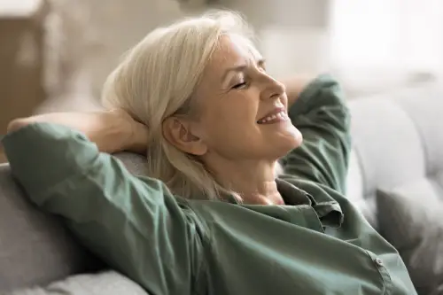 woman relaxes in portland home with clean indoor air quality thanks to air scrubber