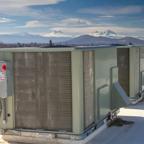 Two HVAC units on top of a commercial building