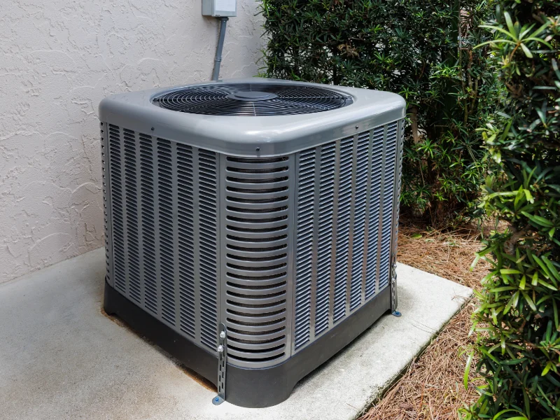 Air conditioning unit outside a residential home ready for Vanport's professional HVAC repairs.