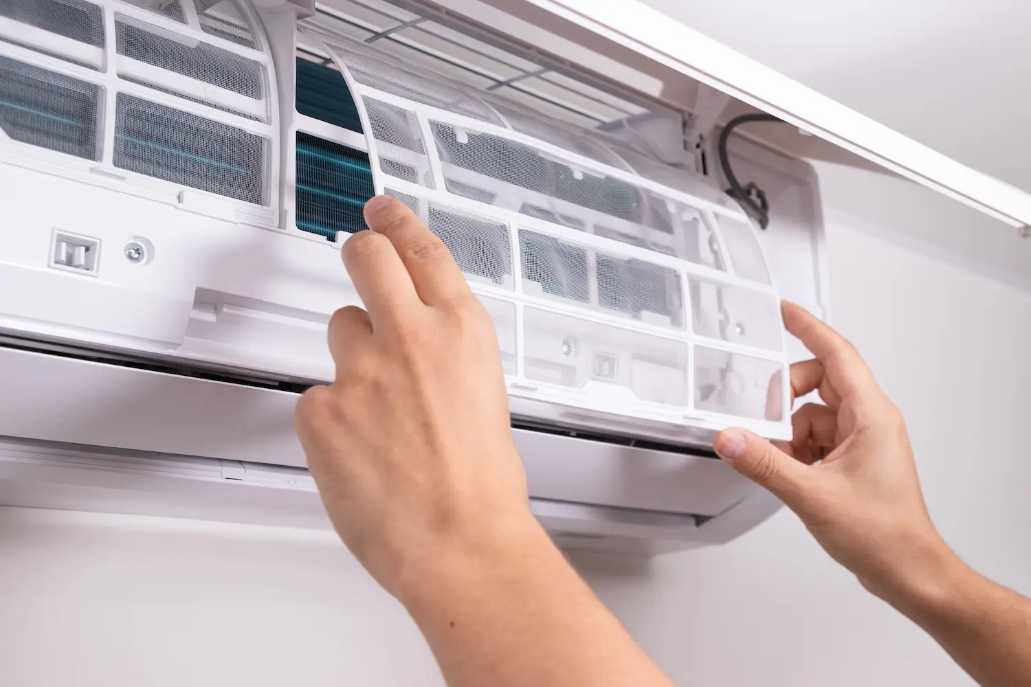 Vanport technician installing a ductless AC unit